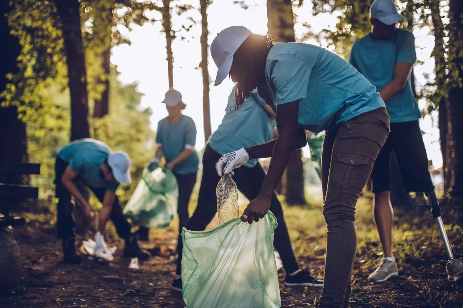  Image depicting people actively participating in environmental clean-up activities as part of corporate social responsibility (CSR) efforts 